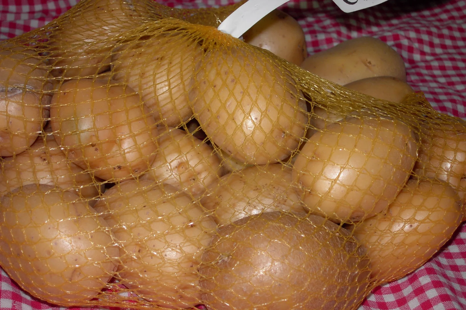 Whole potatoes prepped for slicing with the best mandoline for potatoes