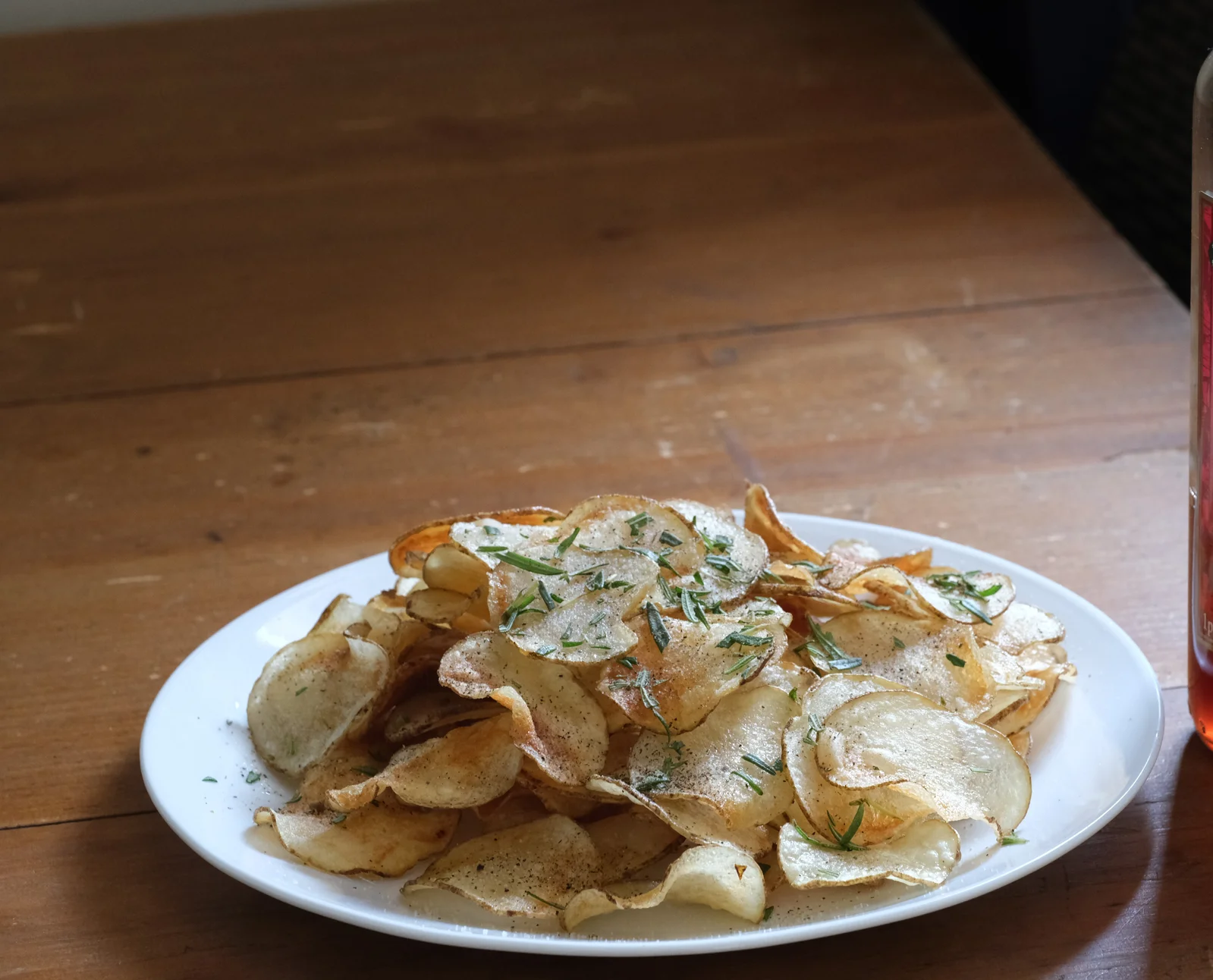 Golden potato chips sliced thin and evenly, the payoff of consistent mandoline slicing